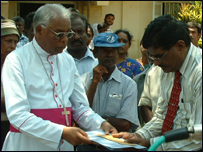Bishop Rayappu Joseph handing over the appeal
