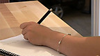 Sending a letter to her baby's father's family. 