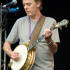 Gerry O'Connor plays banjo for Four Men and a Dog