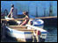 A small craft at the side of the MV Ilala passenger ship, docked at a Lake Malawi port.