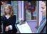 two students filming video in street