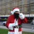 Santa adjusts his beard