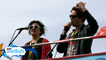 Annie and Nick look over the Big Weekend site from the top of the bus