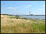 Marsh land with Thames estury behind it.