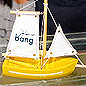 A toy boat in a water tank