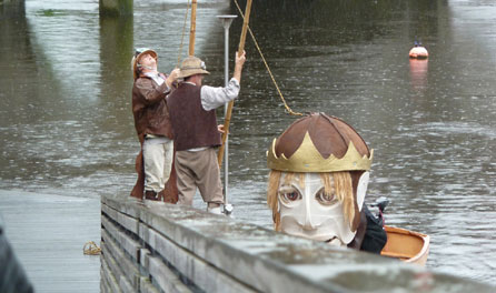 Image of the Bran puppet in a boat. Photo courtesy of the Small World Theatre