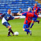 Trevor goes in for the ball...