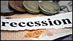 coins, banknotes and newspaper headline