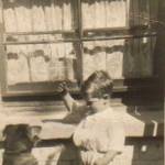 Terry, aged 3 and next doors dog Toby in Lowfield Road, Kilburn Terry, aged 3 and next doors dog Toby in Lowfield Road, Kilburn