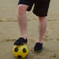 A 20 year old John at the time of the story, on a beach in Donegal