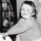 Ruth's father was a gifted craftsman. Here's her middle sister Joan on a rocking horse he made. The cabinet in the background was also made by him