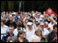 Crowds flock down the 18th fairway