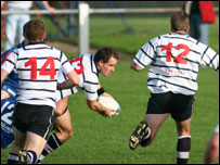 Olly Viney slips the ball to Andy Barnett