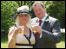 Rose and Phil Booth celebrate their marriage in an Ascot carpark.
