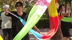 A woman practising a ribbon dance.