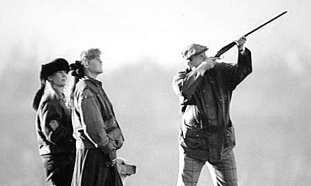 Man aiming shotgun