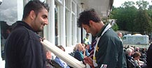 A happy fan getting a sought - after autograph.