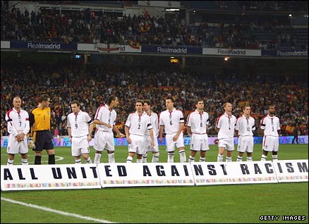 England line-up for the national anthem in front of anti-racism banner during the friendly against Spain in November 2004 at the Estadio Bernabeu in Madrid
