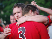 Jersey players console each other after their loss