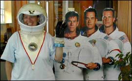 The cardboard cut-out cast of Apollo 13 with a Learning Centre member