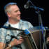 Donal Murphy plays accordion for Four Men and a Dog