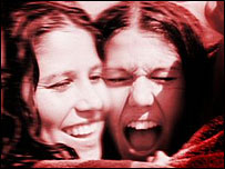 Two girls laughing.