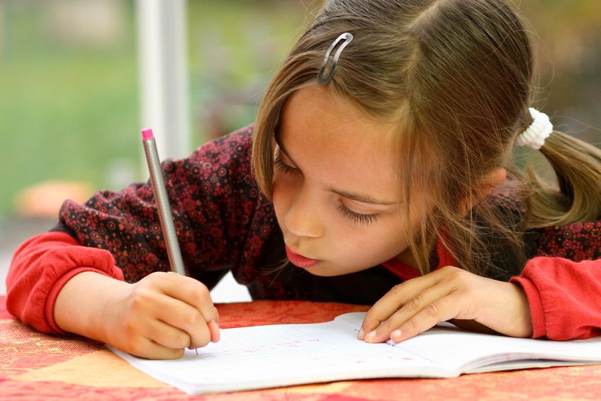 girl doing her homework carefully @ Eleonore H
