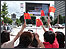 Chinese flags flying high at the big screen
