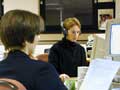 Journalists at work in the newsroom.