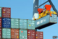 A container being moved at a dock