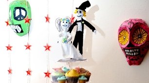 Liz's wedding figurines atop a cupcake tower
