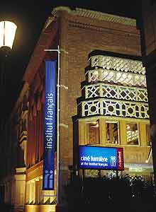 The Ciné Lumière cinema at night.