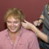 Alan Carr tries his Elton wig on for size. 