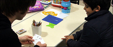 Playing cards with one of the children