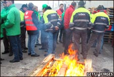 Workers blockading the InBev brewery in Leuven, Belgium