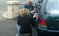 Laura strokes a car