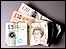 Money: a £5 note, £10 note and £20 note