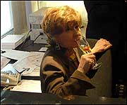 Prunella behind the reception desk