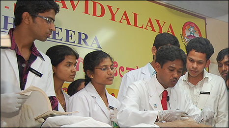 Dr Mahantesh Ramannavar (in red tie) at work