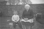 Roger and his grandmother on the farm