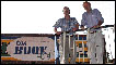 Paul Brickhill (left) and Mike Thompson (right) outside the Book Cafe in Zimbabwe, Harare
