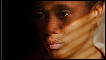 A Haitian woman in Florida watches news of the earthquake on television