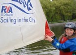 Girl holding a sail