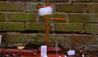 Yan sets off three canister rockets at the same time.