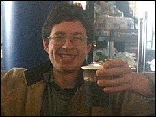 Yan enjoys a coffee