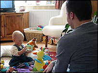A father playing with a baby