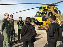 Students and crew by the Sea King