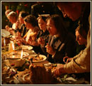 Men and women eating Christmas dinner