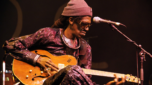 Cheikh Lo and band live at the Old Fruitmarket. Photo by Louis Decarlo.