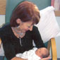 Patience holding baby Chloe from the story